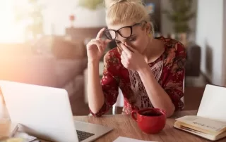 sad woman in front of laptop